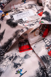 Close-up of a needle cord ski printed shirt with visible brand label, 'Emmett London'.