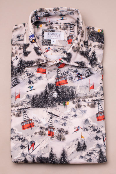 Folded needle corduroy shirt with ski resort pattern on a beige background