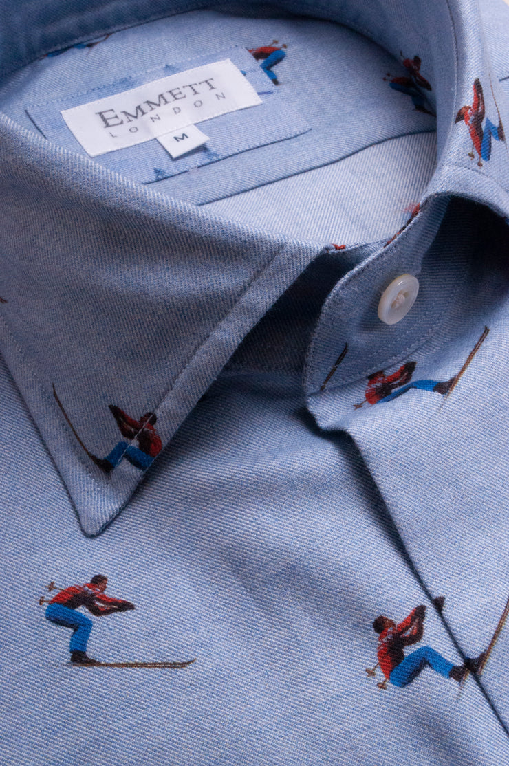 Race Skiers on Light Blue Shirt